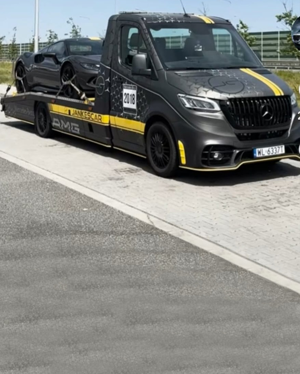 Black Mercedes-Benz flatbed recovery truck ready for deployment in Sheffield